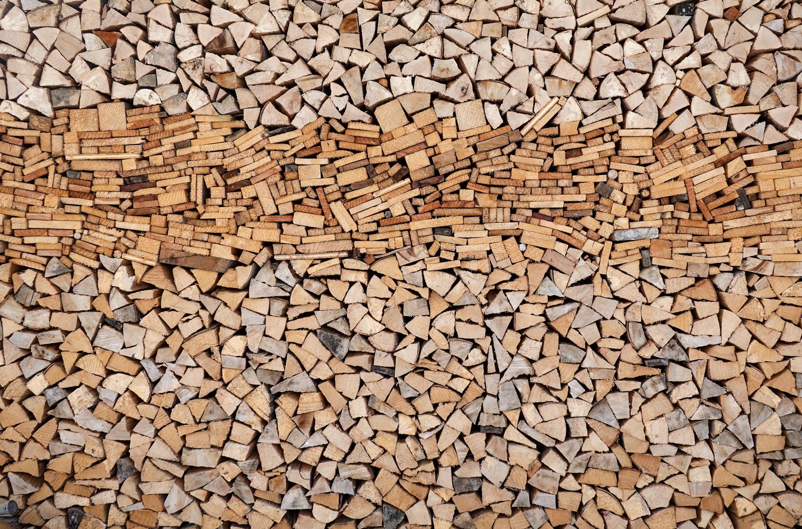 Stack of seasoned logwood cut and ready for burning